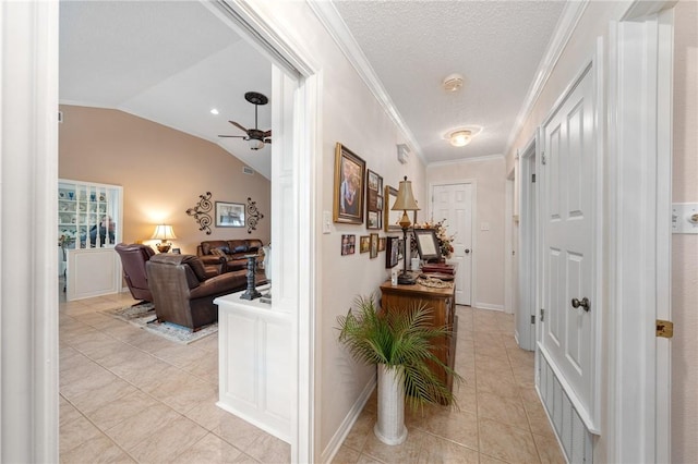 hall with light tile patterned floors, a textured ceiling, vaulted ceiling, and crown molding