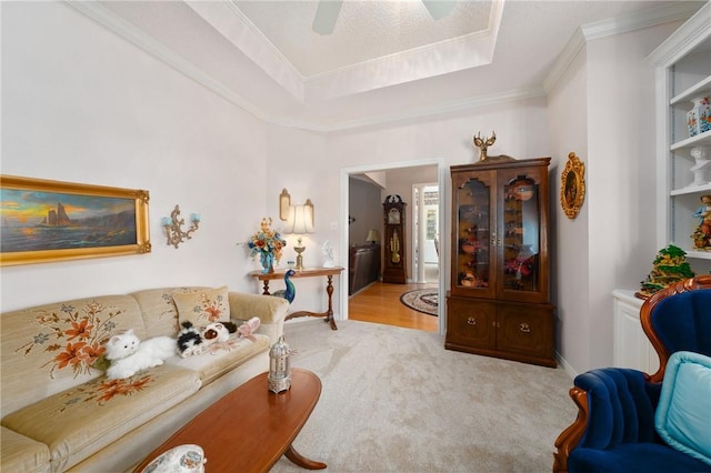 carpeted living room featuring ornamental molding