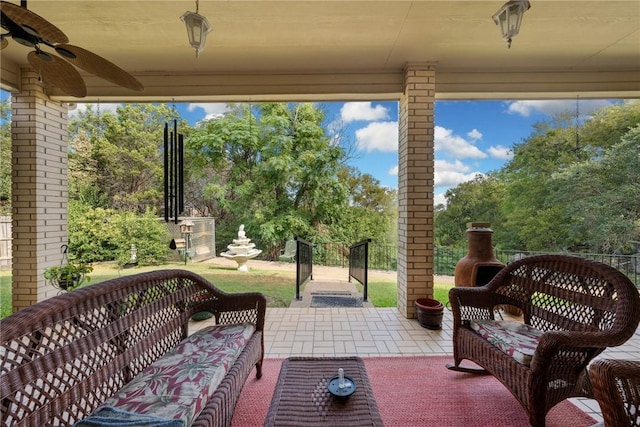 view of patio with ceiling fan and an outdoor living space