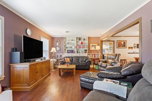 living room with dark hardwood / wood-style flooring and ornamental molding