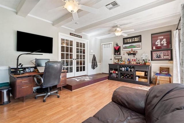 home office featuring french doors, ceiling fan, bar, beamed ceiling, and light hardwood / wood-style floors