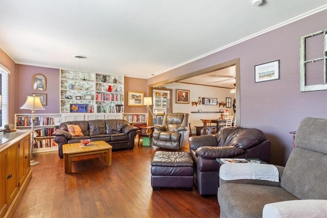 living room featuring ceiling fan, hardwood / wood-style floors, and ornamental molding