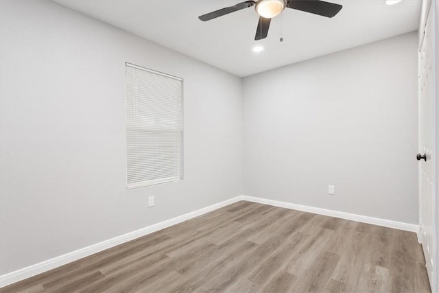 unfurnished room featuring ceiling fan and light wood-type flooring