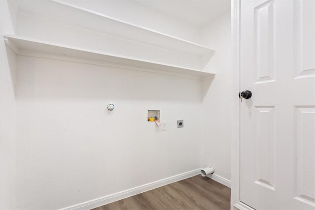 laundry room with hookup for a washing machine, hardwood / wood-style floors, and electric dryer hookup