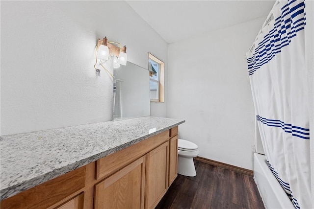 full bathroom featuring hardwood / wood-style flooring, vanity, toilet, and shower / bath combo with shower curtain