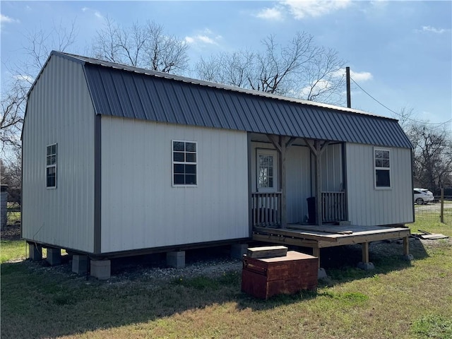 rear view of house with a yard