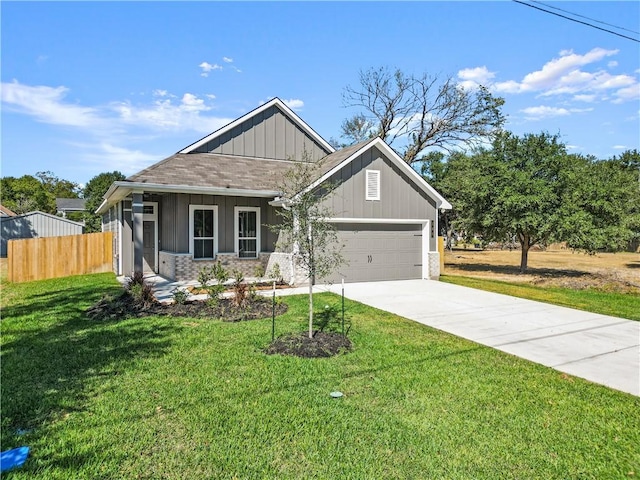 view of front facade with a front yard and a garage