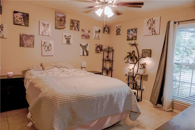 bedroom featuring light tile patterned floors and ceiling fan