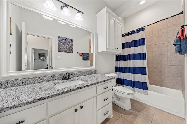 full bathroom with shower / tub combo with curtain, toilet, vanity, and tile patterned flooring