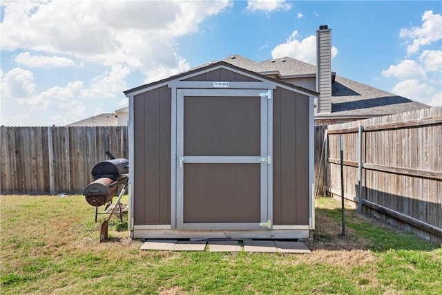 view of outbuilding featuring a lawn