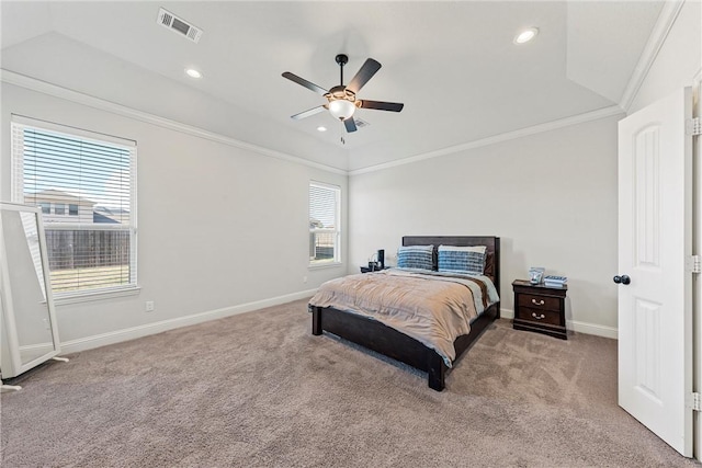 carpeted bedroom featuring ornamental molding, vaulted ceiling, and ceiling fan