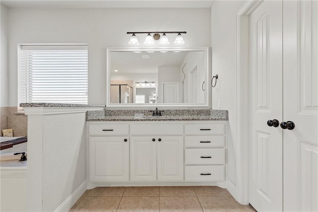 bathroom featuring vanity and tile patterned flooring