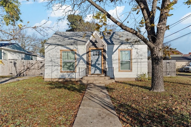 bungalow-style house with a front yard