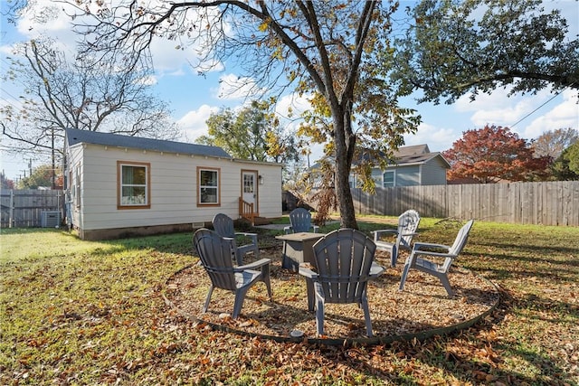 view of yard with a fire pit