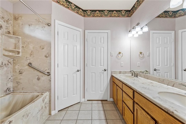 bathroom featuring tile patterned flooring, vanity, and bathtub / shower combination