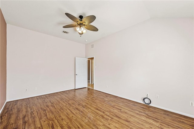 spare room with hardwood / wood-style flooring and ceiling fan