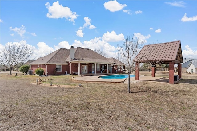 exterior space with a lawn and a patio