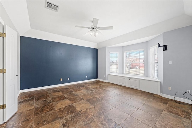 interior space with a ceiling fan, visible vents, and baseboards