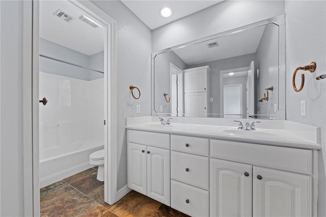 full bath featuring visible vents, a sink, toilet, and double vanity