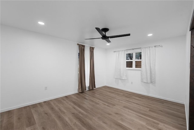 unfurnished room featuring hardwood / wood-style flooring and ceiling fan