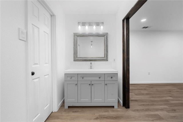 bathroom featuring hardwood / wood-style floors and vanity