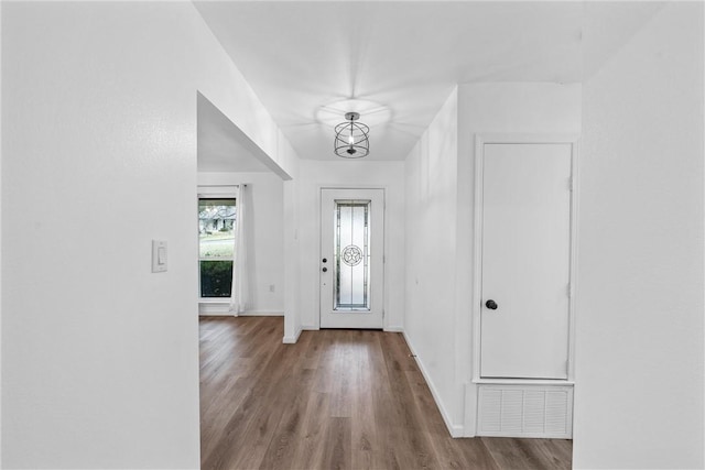 entrance foyer with a chandelier and light wood-type flooring