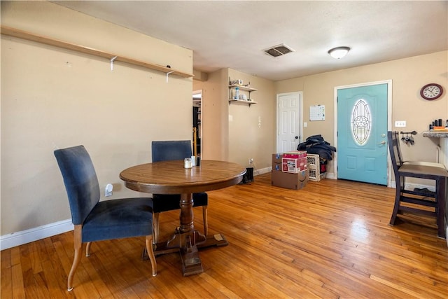 dining room featuring light hardwood / wood-style flooring