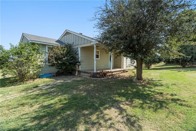 view of property exterior with a lawn