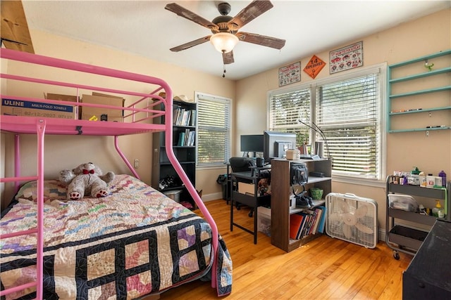 bedroom with hardwood / wood-style floors and ceiling fan