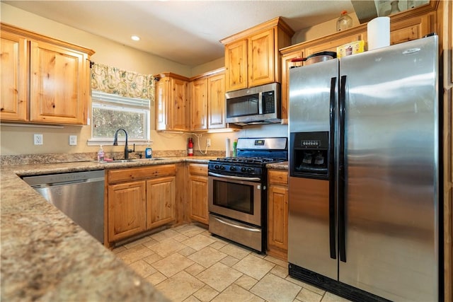 kitchen with appliances with stainless steel finishes and sink