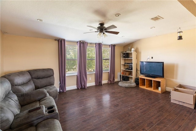 living room featuring a textured ceiling, dark hardwood / wood-style flooring, vaulted ceiling, and ceiling fan