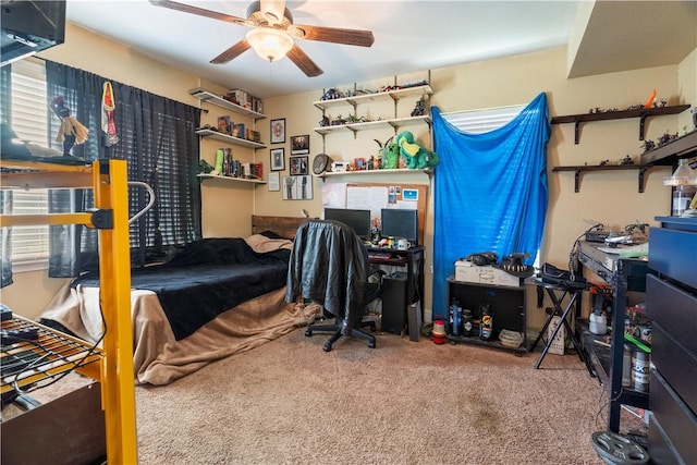 bedroom with carpet flooring, ceiling fan, and multiple windows