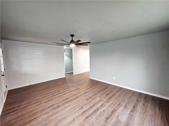 empty room featuring ceiling fan and wood-type flooring