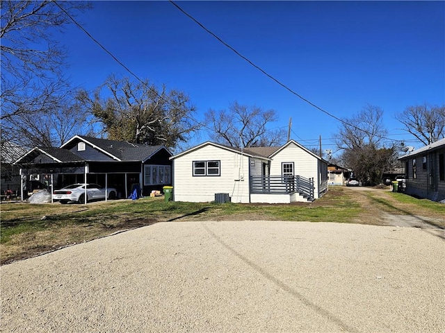 view of home's exterior with a carport