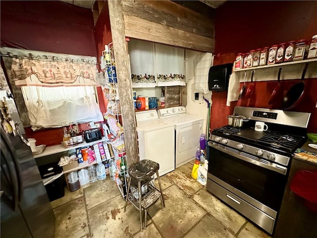 kitchen featuring gas stove and separate washer and dryer