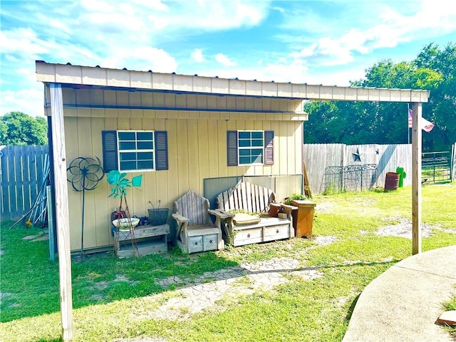 view of outdoor structure featuring a lawn