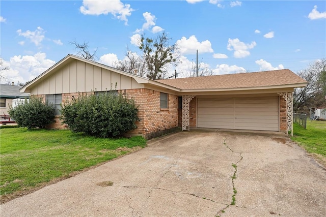 single story home with a garage, concrete driveway, a front yard, board and batten siding, and brick siding