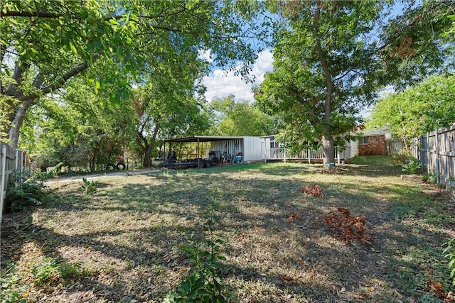 view of yard with a carport