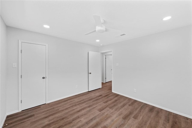 unfurnished bedroom featuring ceiling fan and hardwood / wood-style floors