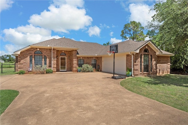 ranch-style home with a front yard and a garage