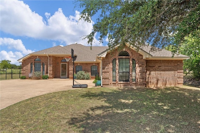 ranch-style home with a front lawn