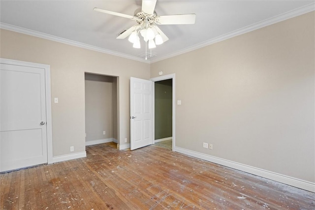 unfurnished bedroom with wood-type flooring, ceiling fan, and crown molding