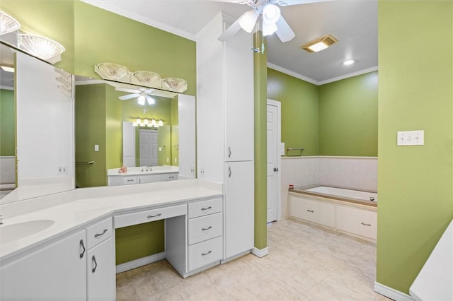 bathroom with ceiling fan, a washtub, vanity, and crown molding