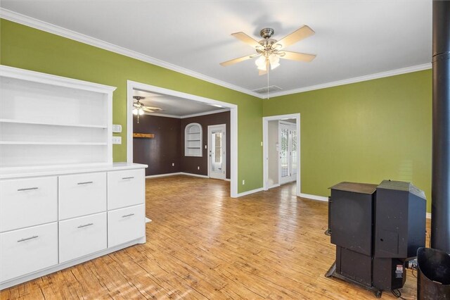 interior space with ceiling fan, light hardwood / wood-style floors, and ornamental molding