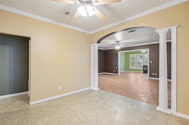 unfurnished room with light hardwood / wood-style floors, ornate columns, ceiling fan, and ornamental molding