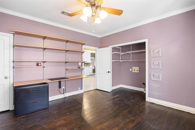 unfurnished office featuring dark hardwood / wood-style floors, ceiling fan, and crown molding