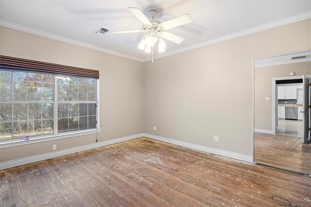 spare room with hardwood / wood-style flooring, ceiling fan, and crown molding