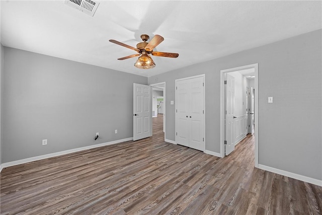 unfurnished bedroom with ceiling fan, light hardwood / wood-style floors, and a closet