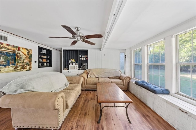 living room with hardwood / wood-style floors, plenty of natural light, and ceiling fan