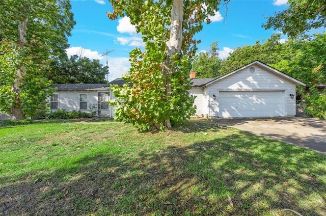 ranch-style home featuring a garage and a front yard